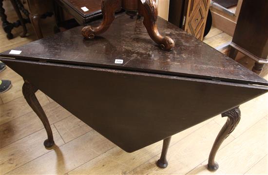A mid 18th century oak triangular topped single drop leaf table, later carved W.116cm